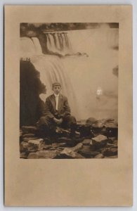 RPPC Handsome Young Man Sitting On Rocks In Studio Niagara Falls Postcard H47