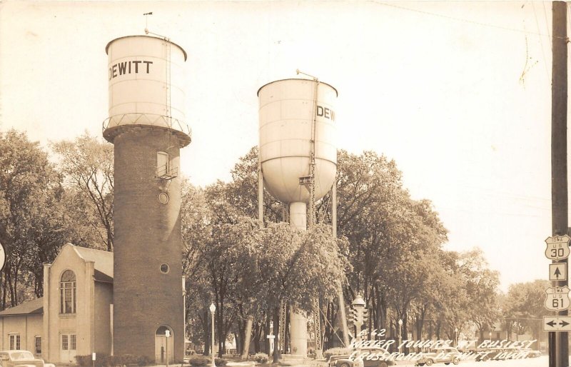 G83/ DeWitt Iowa RPPC Postcard c1940s Water Towers Busy Corner 