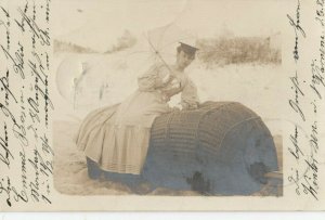 RP: Woman Seated on baskets , 1904 ; Germany