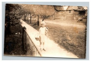Vintage 1910's RPPC Postcard - Small Girl with Easter Basket Country Road