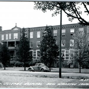 c1950s New Hampton, IA RPPC St Joseph's Hospital Ford Car Real Photo PC A107