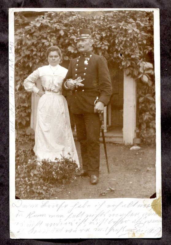 dc112 - AUSTRIA 1902 Decorated Officer with Wife. Sword. Real Photo Postcard