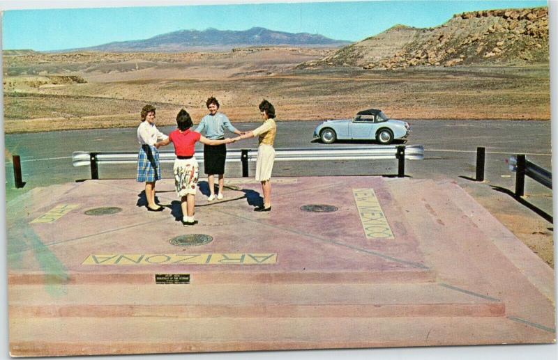 Four women at Four Corners Monument Arizona Utah Colorado New Mexico