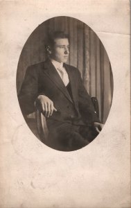 VINTAGE POSTCARD PORTRAIT IN OVAL WINDOW YOUNG MAN MAILED FROM SOUTH BEND 1910