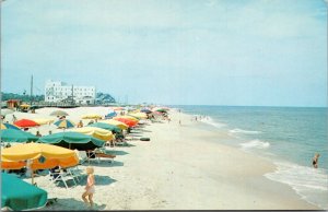 Postcard DE Greetings from Rehoboth Beach child running toward umbrella