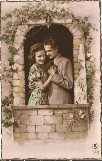 Romantic French Couple posing in Garden Wall with Ivy and Roses