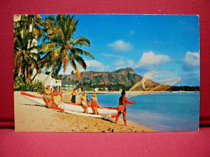 Waikiki Beach, Honolulu, Hawaii Man Throwing Net Women Sitting on Boat Postcard