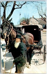 Amish Bishop at hitching post, Old General Store at Intercourse, Pennsylvania 