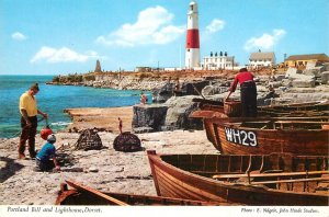 UK England picturesque Dorset Portland Bill and Lighthouse fishing boats and tra