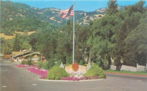 Italian Swiss Colony Winery Exterior View With Flag, Mountains  Asti California