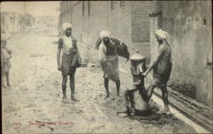 India Bhestees Men Fill Mussicks Water Sacks Pump c1910 Postcard - Ethnography 