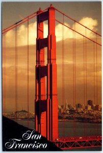 The spectacular north tower of the Golden Gate Bridge with the city - California