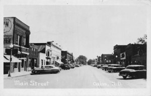 J81/ Oakes North Dakota RPPC Postcard c1950s Main Street Stores 491