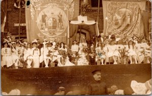 Real Photo Postcard Young Girls and Women Dressed in White on Stage Rose Queen