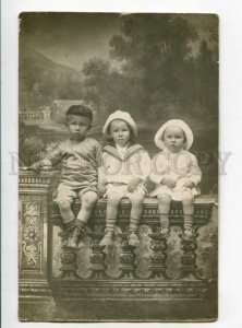 3103693 RUSSIA Charming KIDS on Fence Vintage REAL PHOTO 1915
