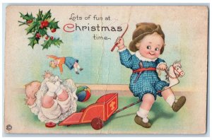 1910 Christmas Children Playing Jack Horse Stick Holly Berries Antique Postcard 