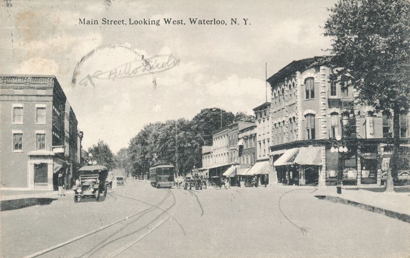 Waterloo NY New York Autos and Trolley on Main Street looking West pm