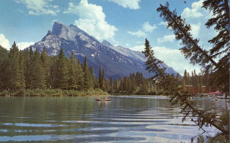 Canoe on Bow River near Mt Rundle AB, Alberta, Canada