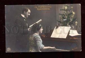 3019199 Man & Lady playing on PIANO Old X-mas RUSSIAN RPPC