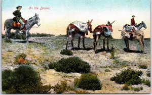 VINTAGE POSTCARD ON THE DESERT OUTDOORSMEN ON MULES IN S.W. DESERT c. 1905