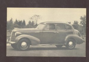 1937 PONTIAC SUICIDE DOORS VINTAGE CAR DEALER ADVERTISING POSTCARD