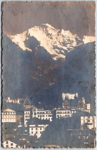 VINTAGE POSTCARD MT. JUNGFRAU AND THE TOWN OF INTERLAKEN SWITZERLAND RPPC 1922