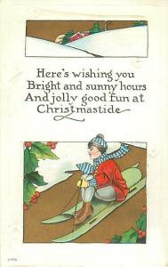 Child on Green Sled Embossed Divided Back Christmastide Christmas Postcard 