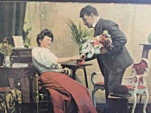 Postcard Hand Tinted 1909 Gentleman giving Flowers to a Lady.      Y5