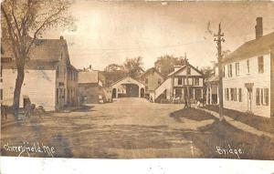 Cherryfield ME Dirt Street Storefronts Covered Bridge RPPC Postcard