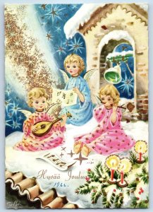 1966 Christmas Angels Cherub Caroling Candle Lights Winter Scene Posted Postcard