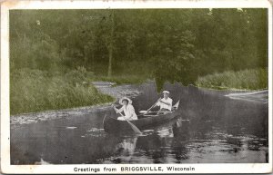 Greetings from Briggsville Wisconsin RPPC Vintage Postcard Man & Woman Canoeing