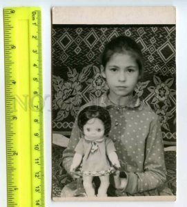 492007 USSR 1969 new serious girl with doll photo