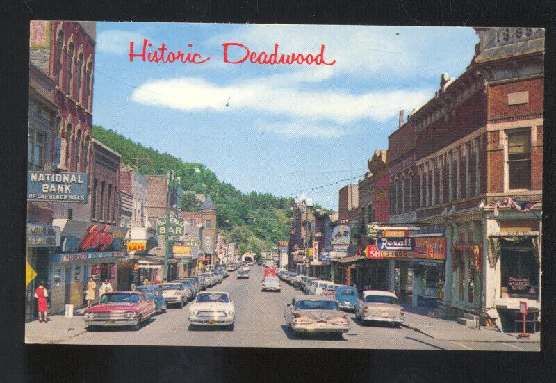 DEADWOOD SOUTH DAKOTA 1950's CARS DOWNTOWN STREET SCENE VINTAGE POSTCARD