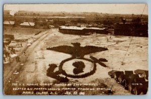 The US Marine Emblem Formed Seated Parade Ground Paris Island SC RPPC Postcard