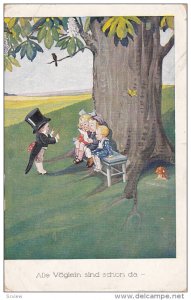 Alle Voglein sind schon da, Boy conductor children singing sitting under tree...