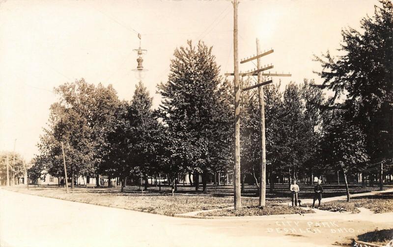 Deshler Ohio~Boys AT Corner of City Park w/Weiner Dog? Hanging Light~RPPC 1914 