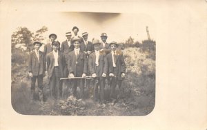 1910s RPPC Real Photo Postcard Large Group Men Standing Outside Holdings Canes