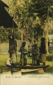 indonesia BORNEO Dayak Women pounding Rice 1900s Postcard