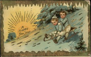New Year Little Boys Sledding Gilt Inlay c1910 Gel Vintage Postcard