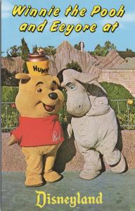 Disneyland, Winnie the Poo and his friend Eeyore dance and frolic at Fantasyland