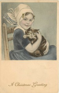 M.M. Vienne 296 Postcard Christmas Greetings Little Girl Holds a Brown Tabby Cat