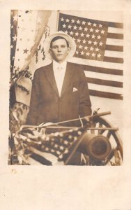 Martinez California Patriotic Man with US Flag and Cannon Real Photo PC AA83009