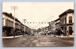J90/ Independence Iowa RPPC Postcard c1922 Main Street Stores  274