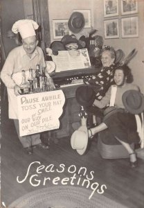 Season's Greetings Piano Playing Lady with Hats Real Photo Postcard AA19004