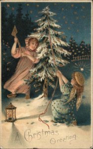 Christmas Fantasy Little Girl and Angel Chop Down Tree c1910 Vintage Postcard