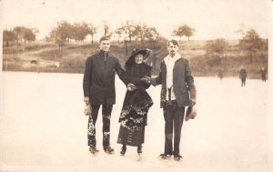 Lady and Men Ice Skating Real Photo Vintage Postcard AA26940