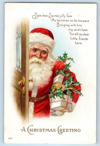 c1910's Christmas Greeting Santa Claus With Gifts Embossed St. Peter MN Postcard