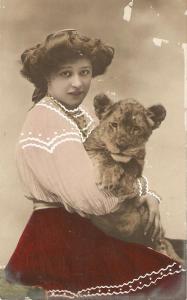 \Lady holding lion cub\ Antique postcard