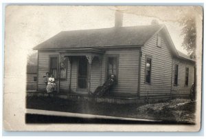 1911 Home Residence View Family Girl Manistee Michigan MI RPPC Photo Postcard 