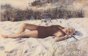 Pin Up Girl Wearing Bathing Suit On The Beach